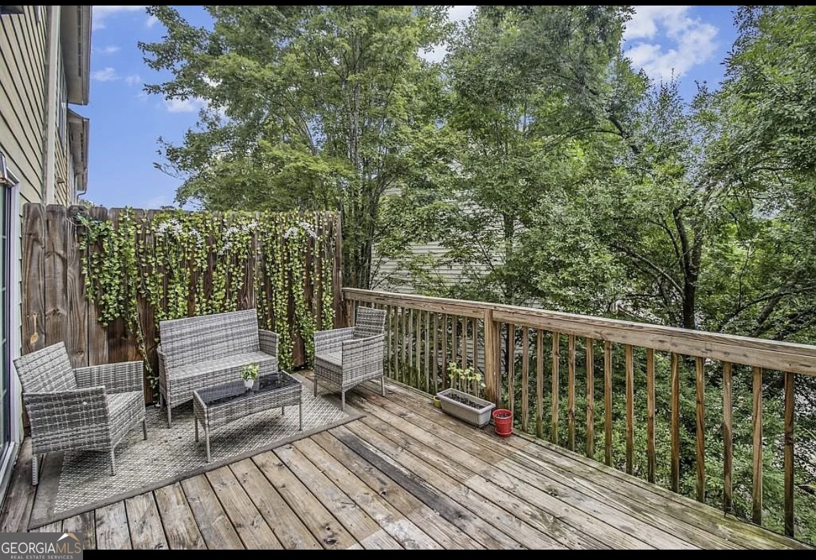 3669 Utoy Drive Southwest Atlanta, GA 30331 - Photo 22 of 22 a view of balcony with wooden floor and outdoor seating