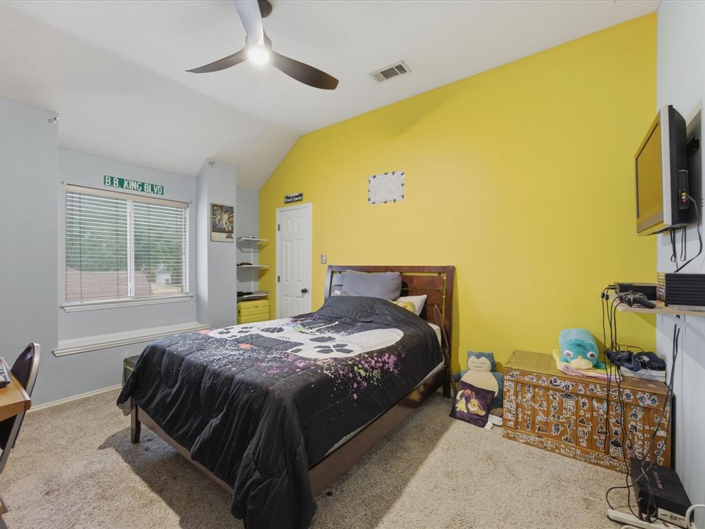 4008 Falcon Ridge Drive Haltom City, TX 76137 - Photo 27 of 40 Carpeted room featuring a ceiling fan with integrated lighting, a window with blinds, and an integrated window bench