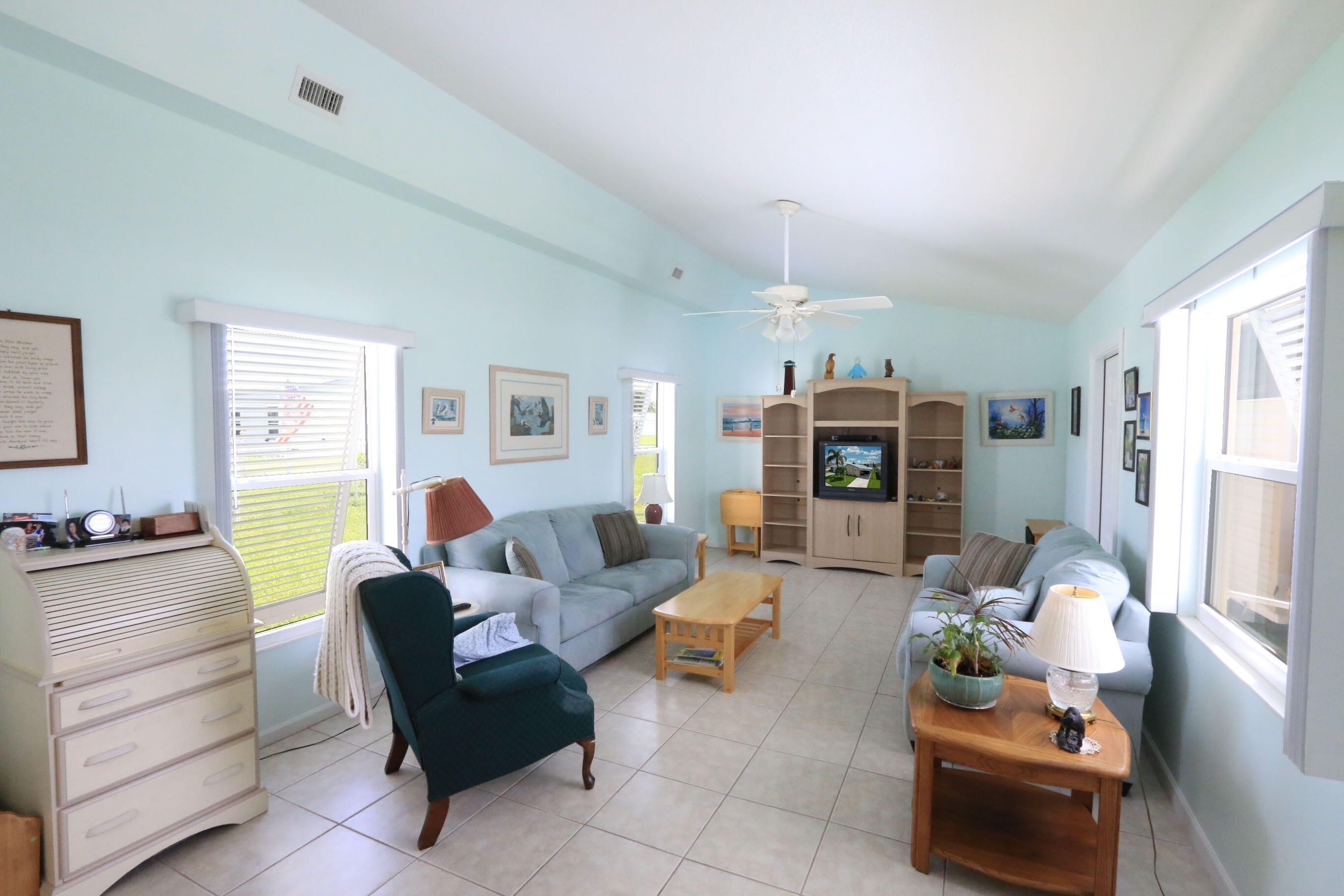 4350 Southwest 9th Way Okeechobee, FL 34974 - Photo 12 of 52 a living room with furniture and a fireplace