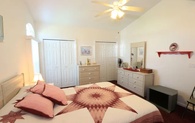 a bedroom with a bed and a dresser