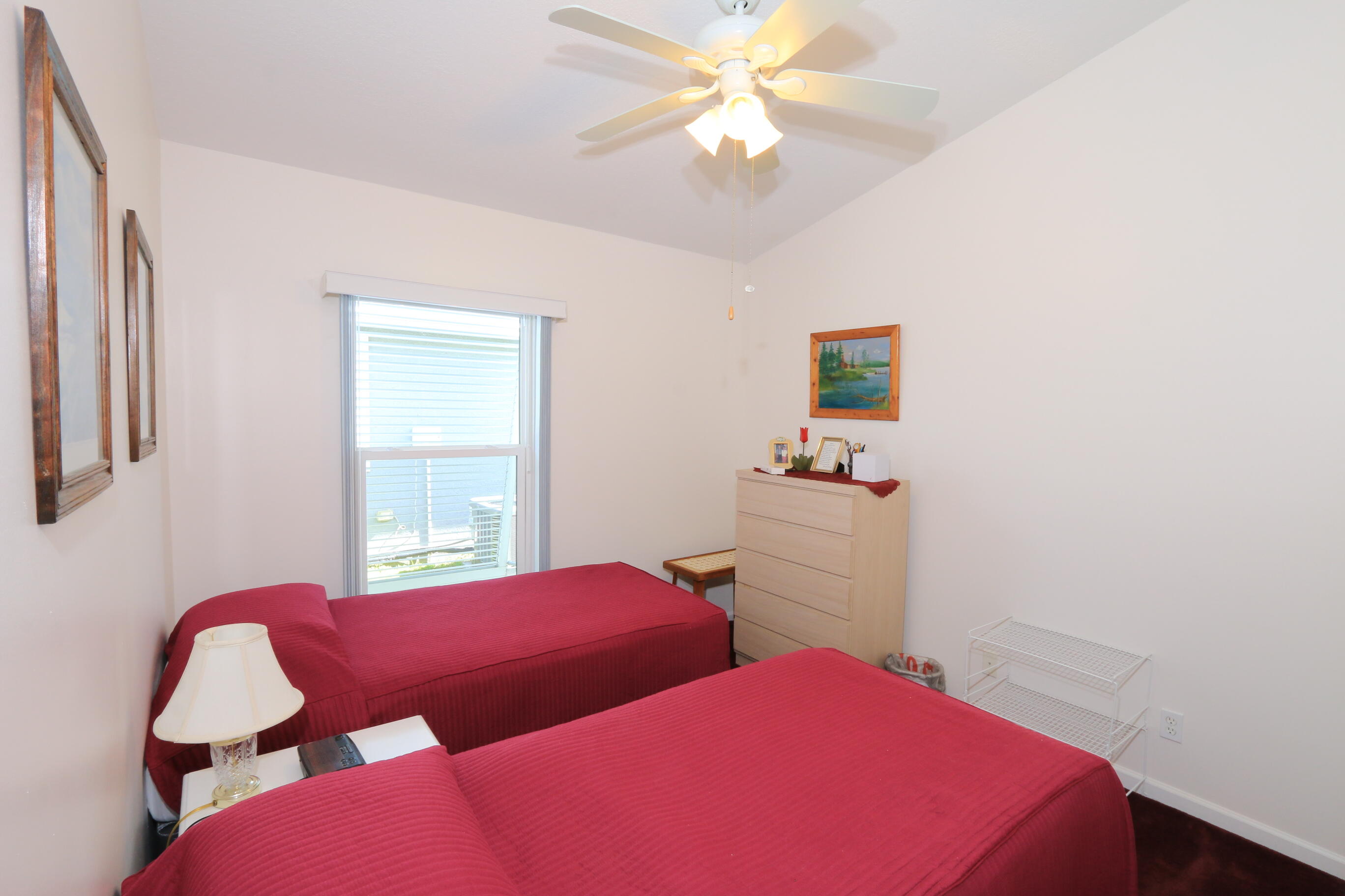 4350 Southwest 9th Way Okeechobee, FL 34974 - Photo 22 of 52 a bedroom with two beds and a window
