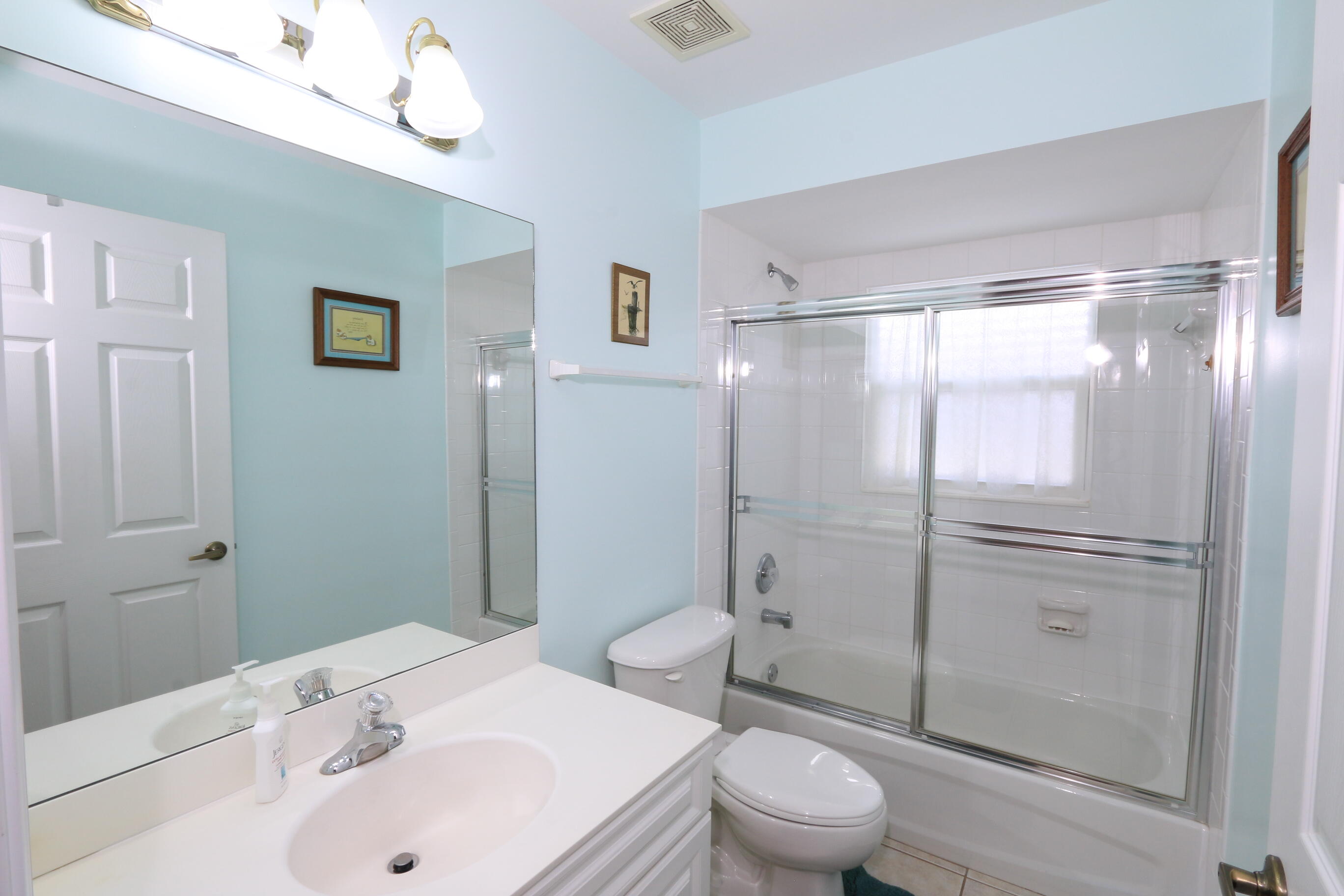 4350 Southwest 9th Way Okeechobee, FL 34974 - Photo 23 of 52 a bathroom with a sink a toilet and shower