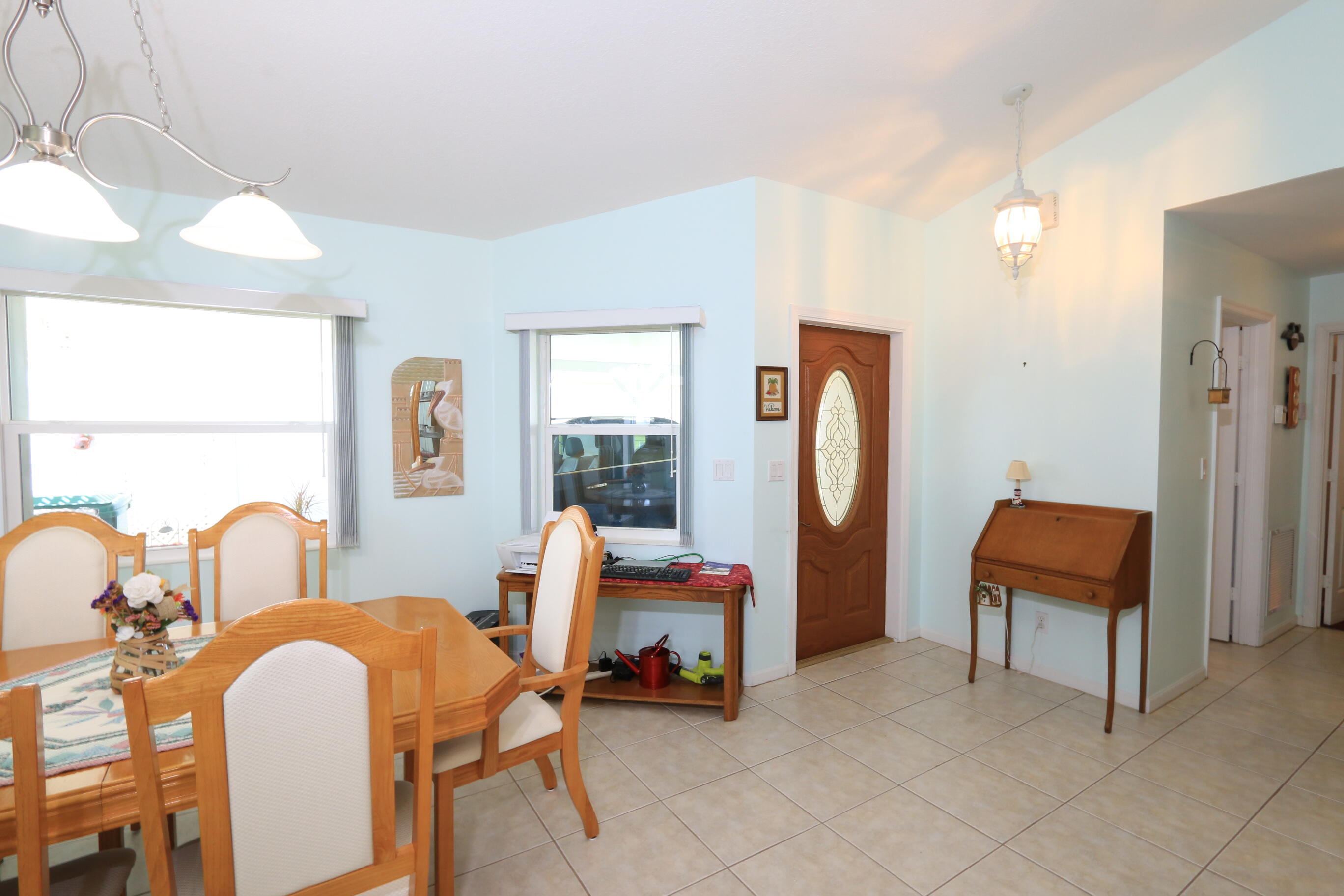 4350 Southwest 9th Way Okeechobee, FL 34974 - Photo 3 of 52 a room with table chair and a large window