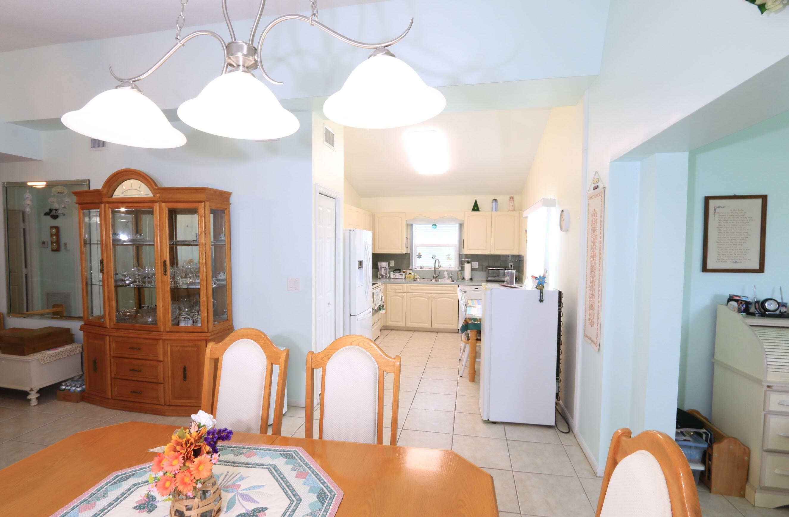 4350 Southwest 9th Way Okeechobee, FL 34974 - Photo 6 of 52 a dining room filled with furniture and chandelier