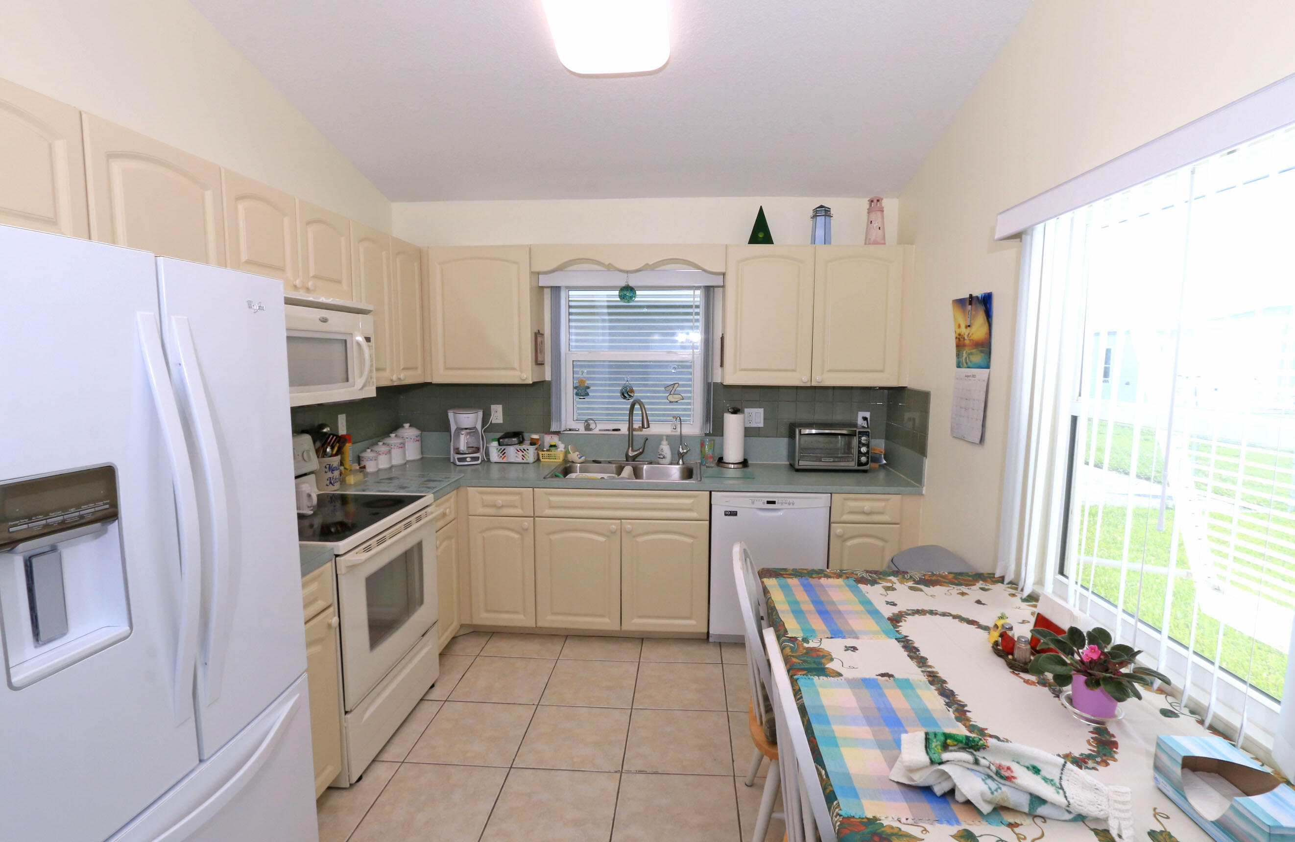4350 Southwest 9th Way Okeechobee, FL 34974 - Photo 7 of 52 a kitchen with stainless steel appliances a stove a sink and a refrigerator