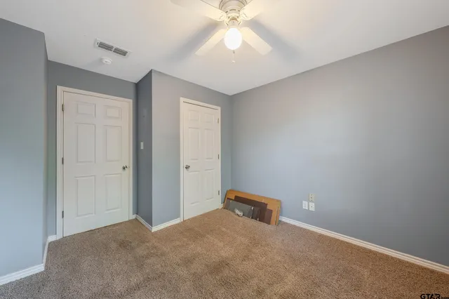 a bathroom with a sink vanity and a mirror