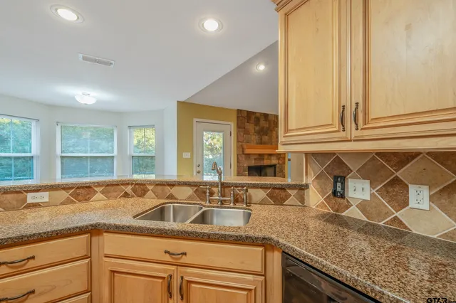 a kitchen with granite countertop a sink and a granite counter tops