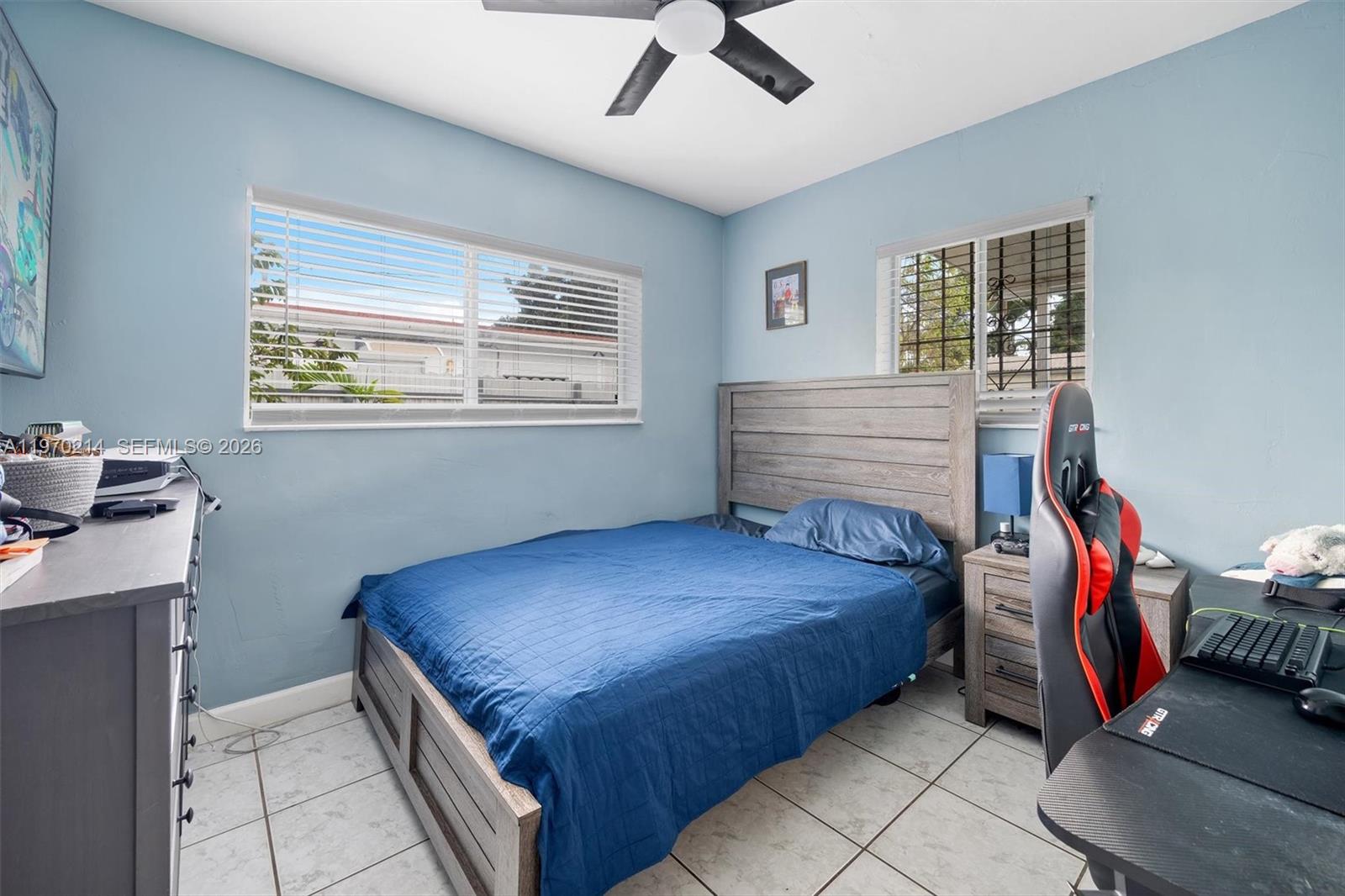 590 West 35th Place Hialeah, FL 33012 - Photo 5 of 16 a bedroom with a bed and a window