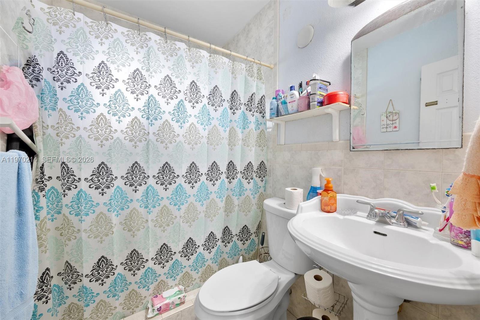 590 West 35th Place Hialeah, FL 33012 - Photo 9 of 16 a bathroom with a sink and a toilet