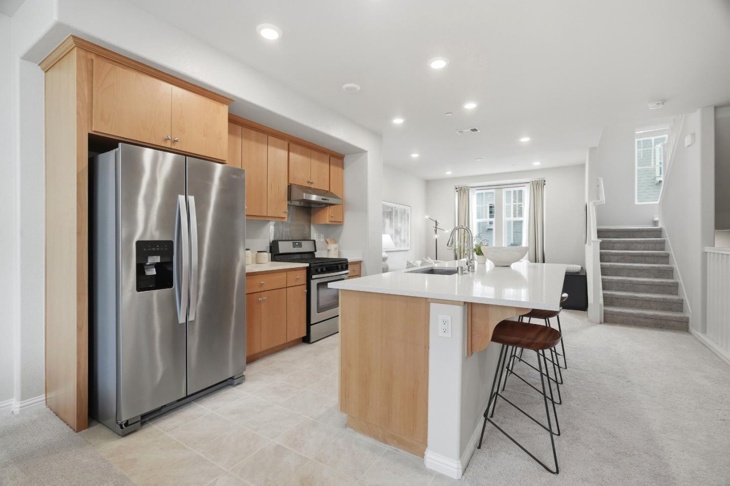 217 Orbit Way Mountain View, CA 94043 - Photo 11 of 53 a kitchen with refrigerator and chairs