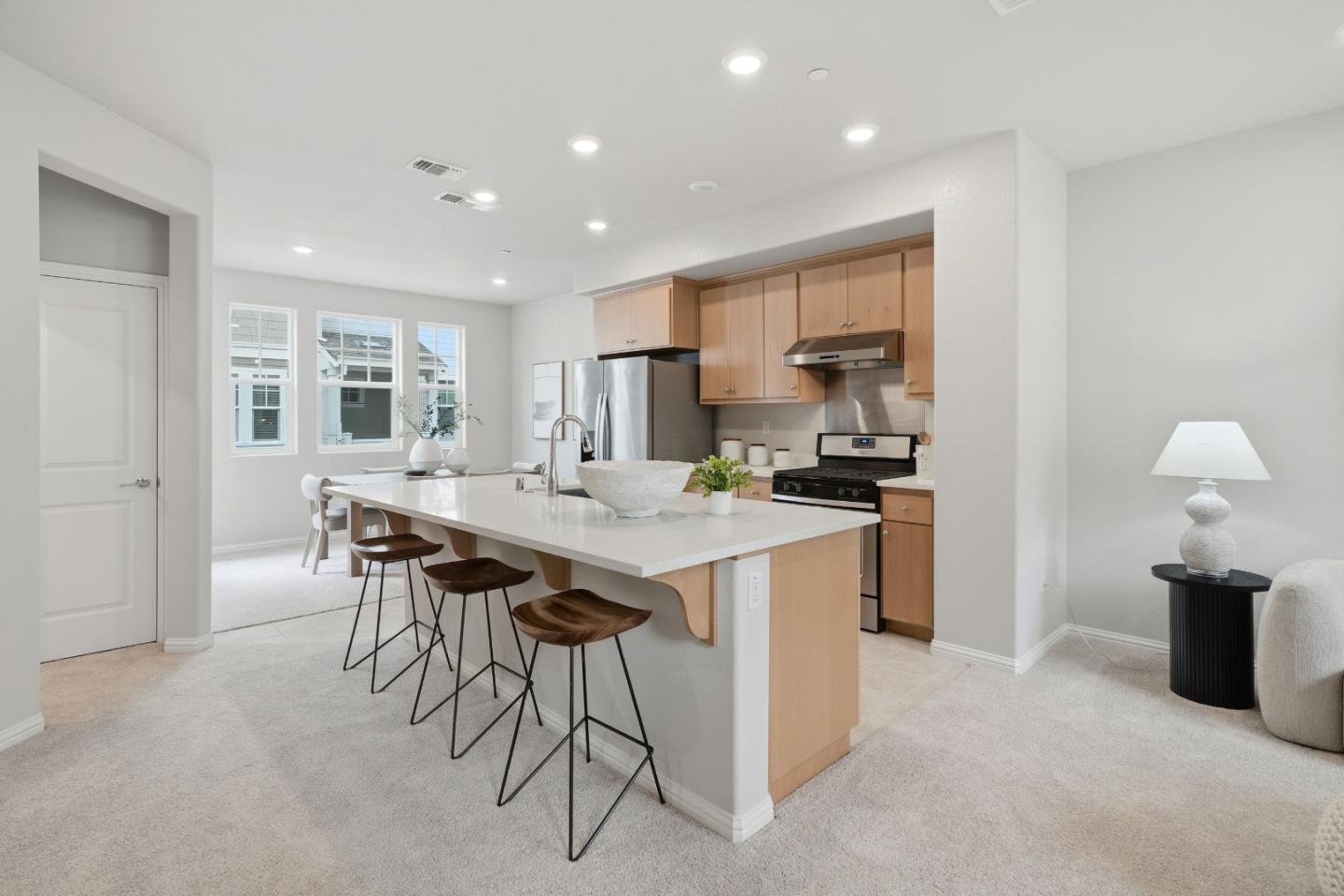 217 Orbit Way Mountain View, CA 94043 - Photo 12 of 53 a kitchen with kitchen island granite countertop wooden cabinets and a refrigerator
