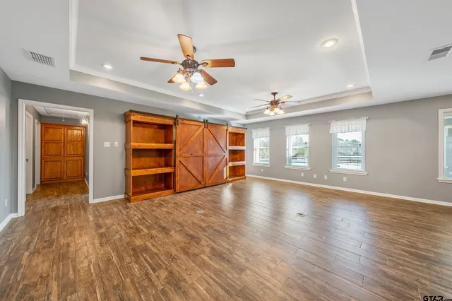 a view of a kitchen with wooden floor and a kitchen