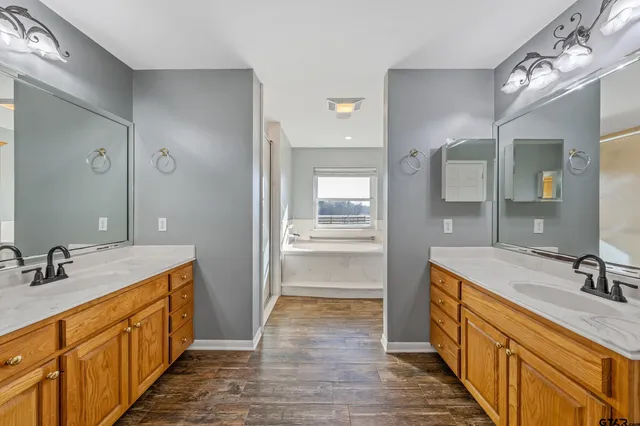 a bathroom with a bathtub and a shower