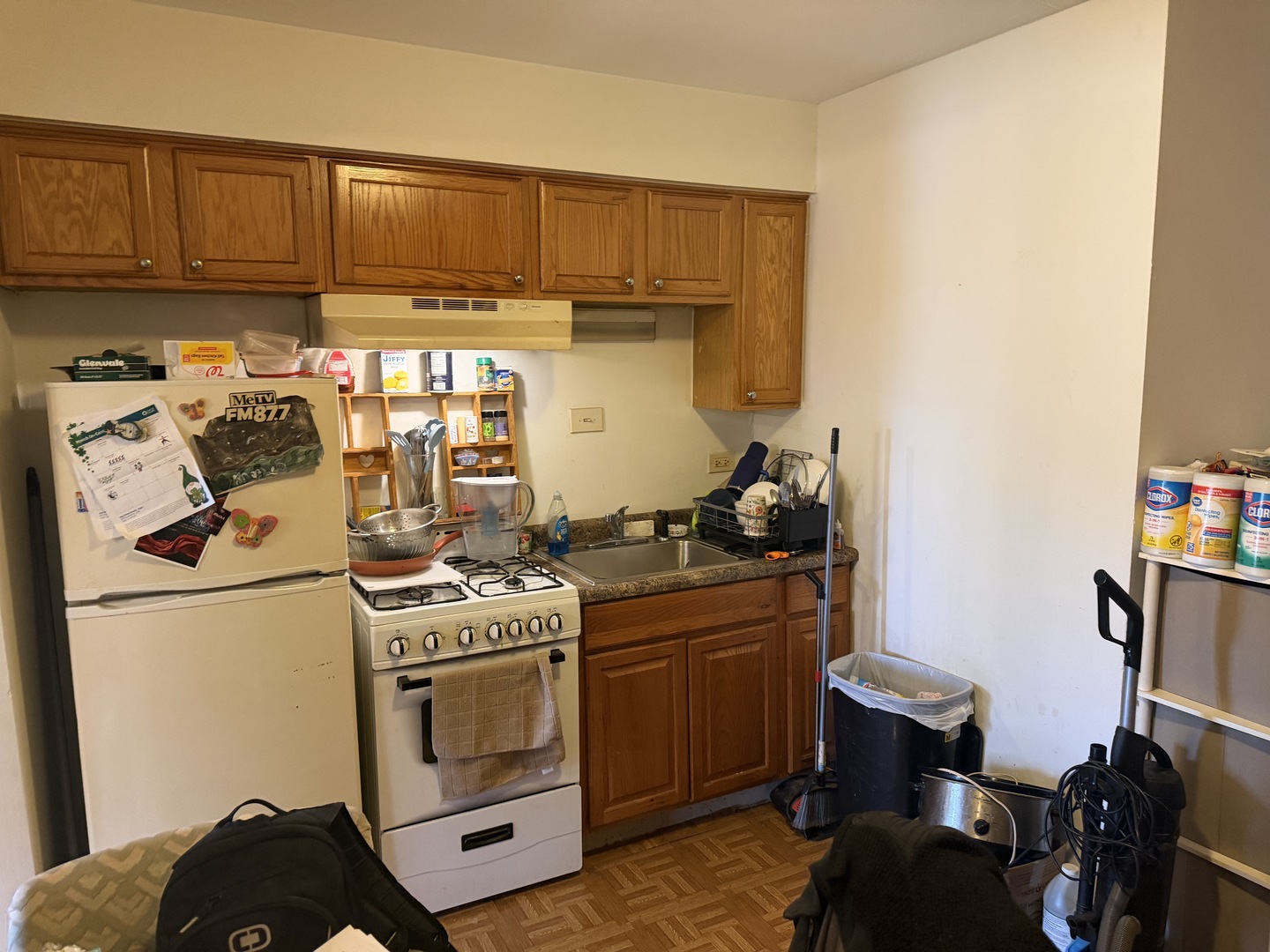 75 Willard Avenue, Unit 4 Elgin, IL 60120 - Photo 7 of 18 a kitchen with a stove and a refrigerator