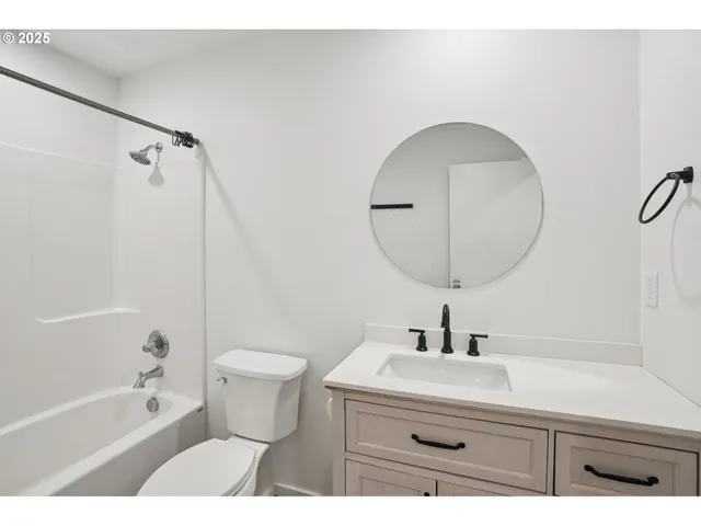 a bathroom with a sink a toilet and a bathtub