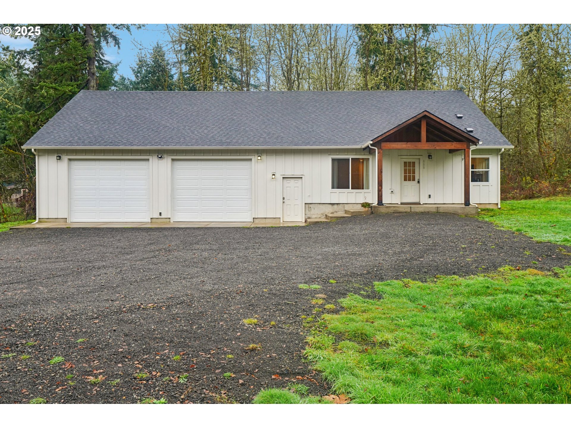 111 Finn Hall Road Woodland, WA 98674 - Photo 2 of 47 a house with trees in the background