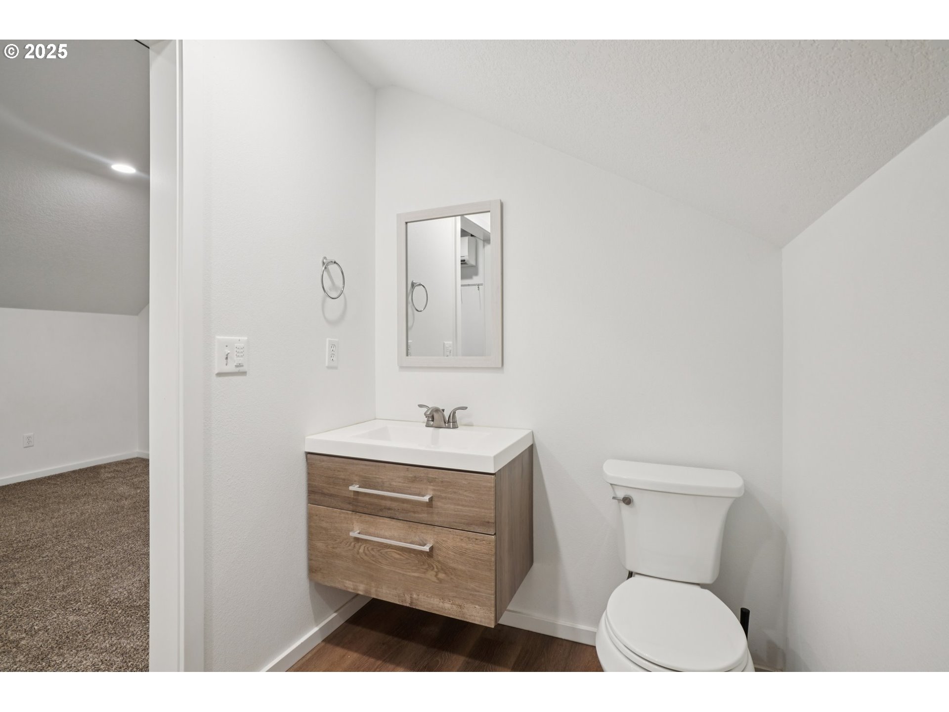 111 Finn Hall Road Woodland, WA 98674 - Photo 25 of 47 a bathroom with a toilet sink vanity and mirror