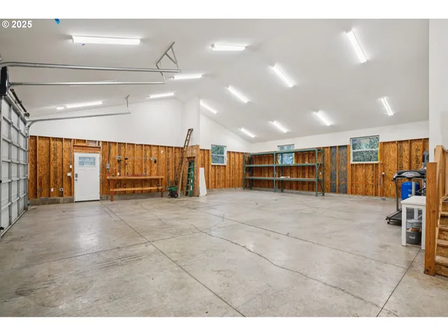 a living room with furniture and a book shelf