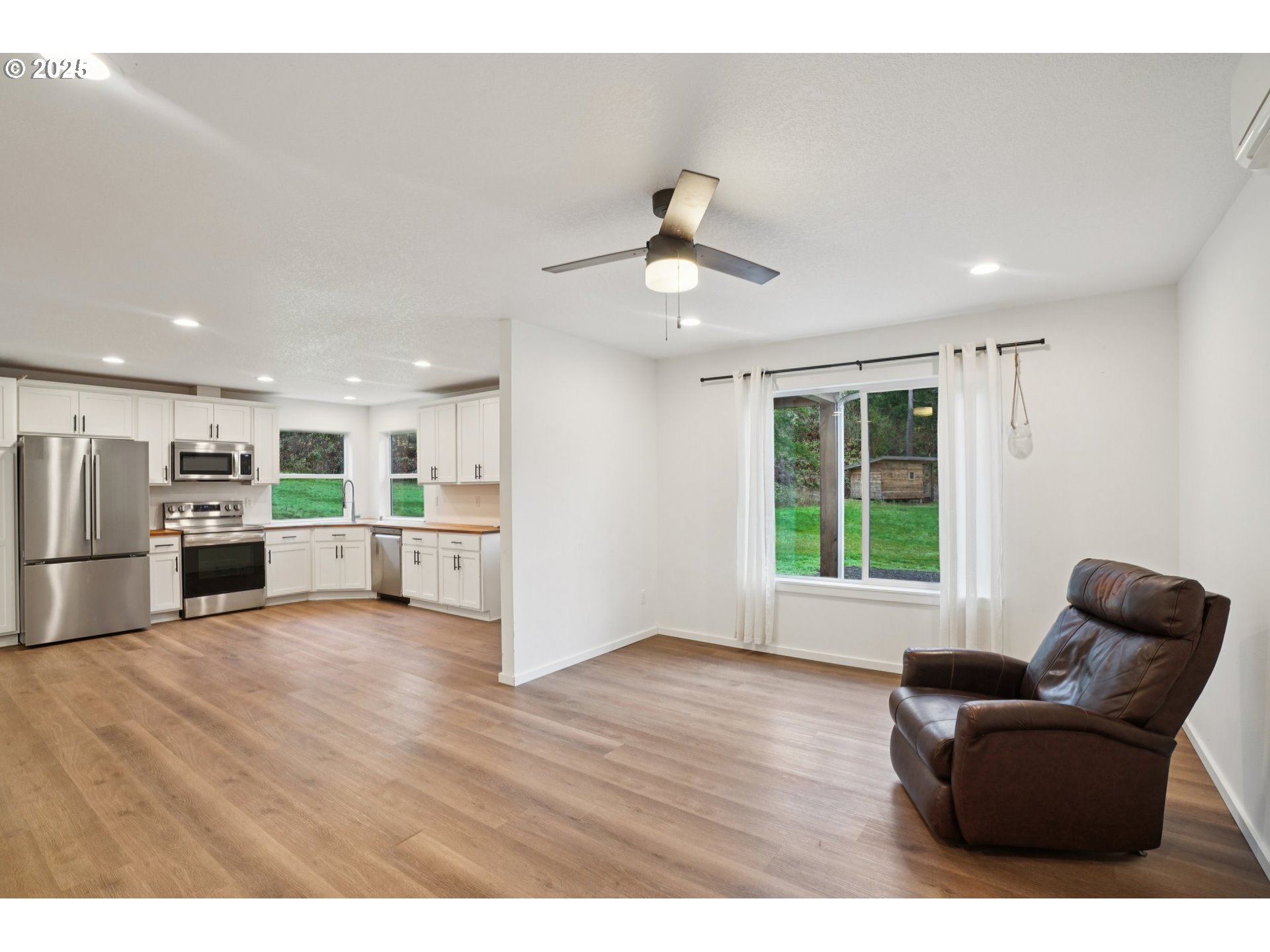 111 Finn Hall Road Woodland, WA 98674 - Photo 10 of 47 a view of kitchen with furniture and wooden floor