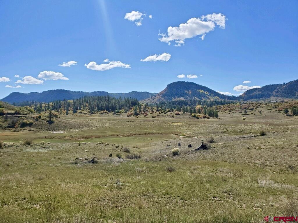 265 Spring Creek Circle Chromo, CO 81128 - Photo 4 of 13 a view of a lake with sunset
