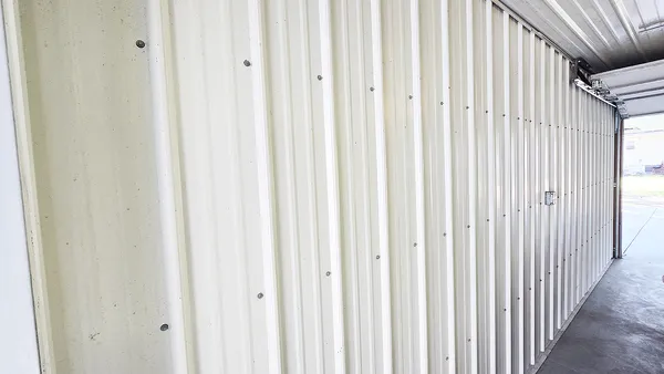 a view of a balcony with wooden fence