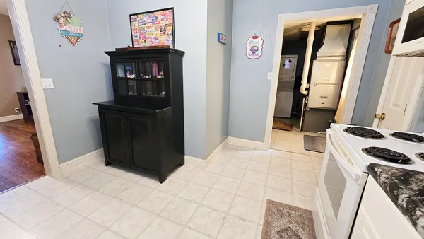 a bedroom with a bed and a mirror on the dresser