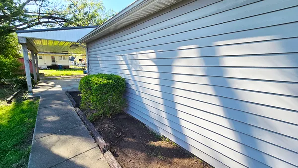 a view of a back yard of the house