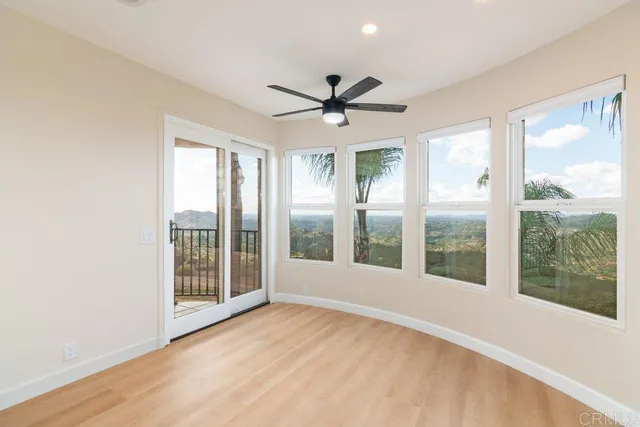 a kitchen with stainless steel appliances a stove refrigerator sink and microwave