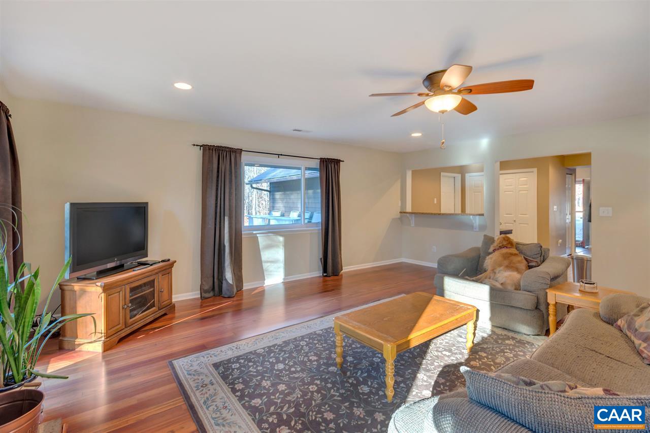 1065 Hunters Ridge Road Earlysville, VA 22936 - Photo 14 of 27 a living room with furniture and a flat screen tv