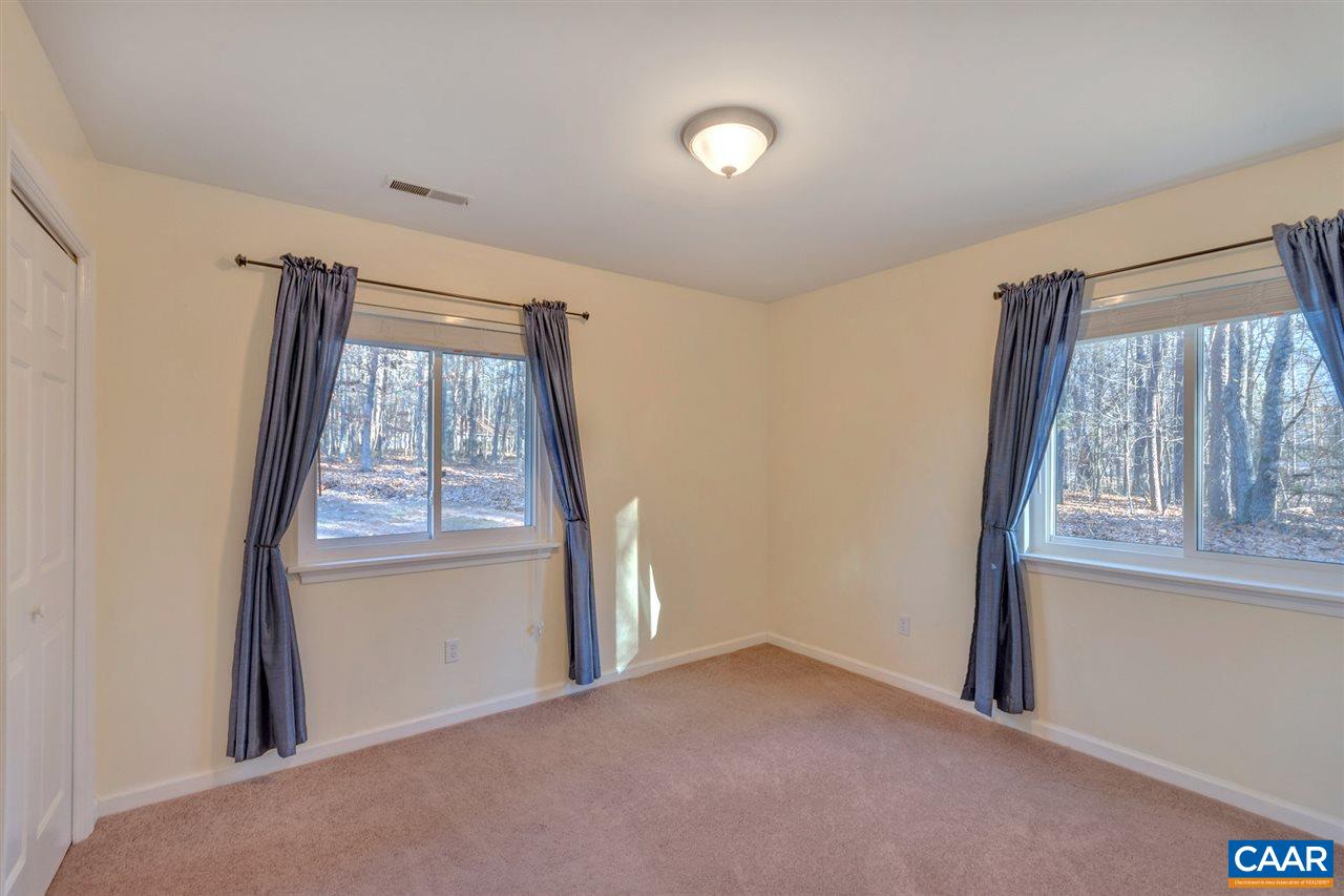 1065 Hunters Ridge Road Earlysville, VA 22936 - Photo 17 of 27 an empty room with windows