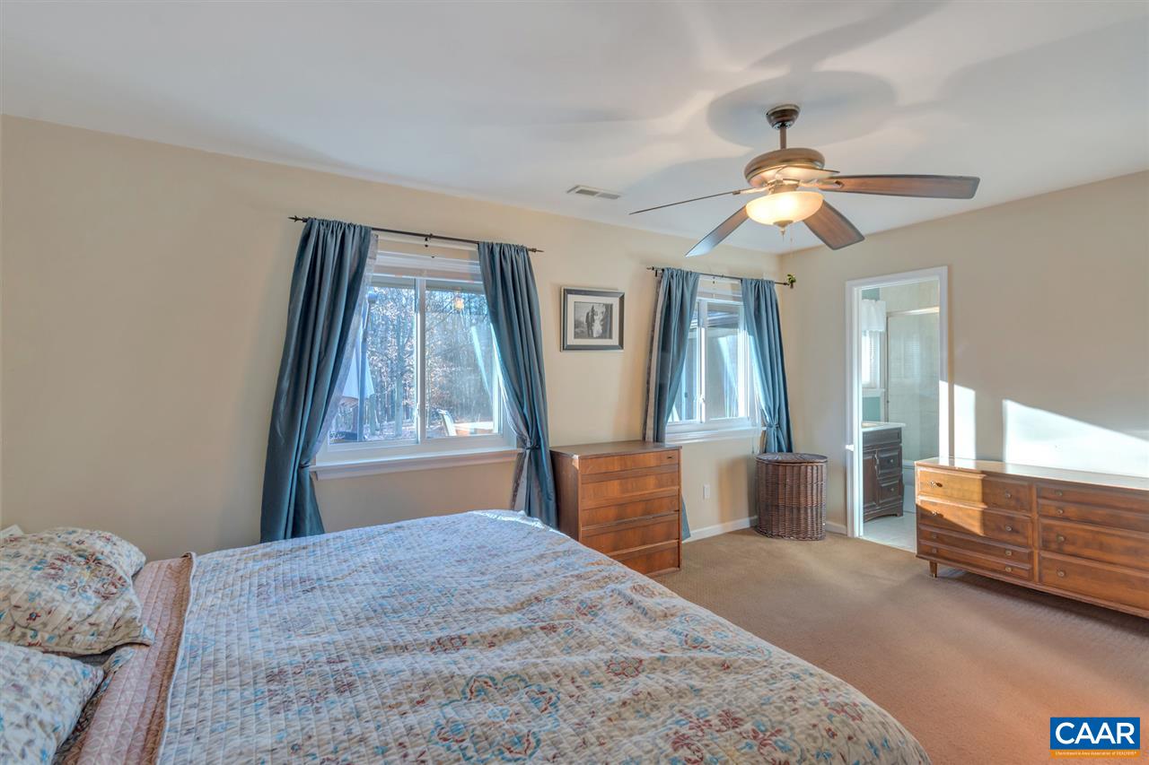 1065 Hunters Ridge Road Earlysville, VA 22936 - Photo 18 of 27 a bedroom with a bed and a window