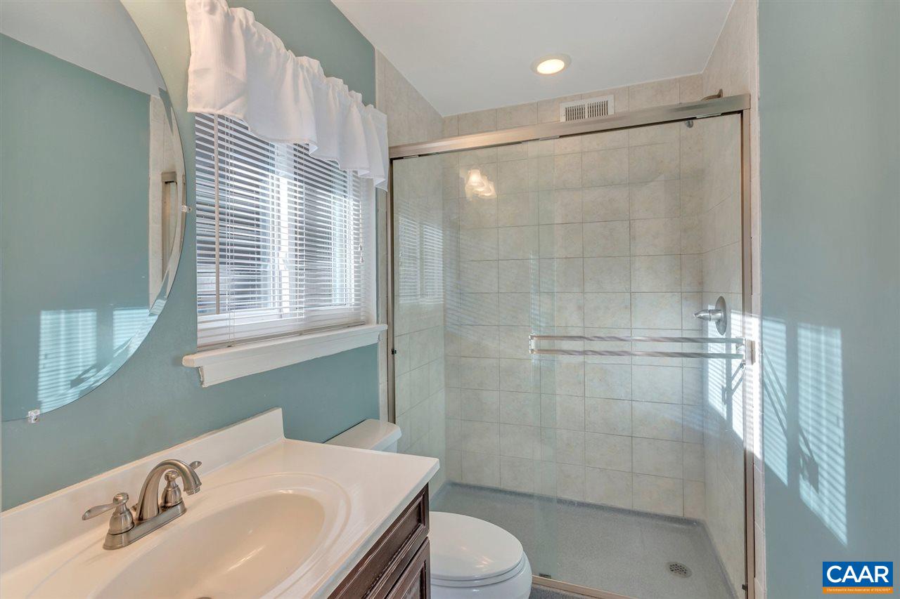 1065 Hunters Ridge Road Earlysville, VA 22936 - Photo 19 of 27 a bathroom with a sink toilet and shower