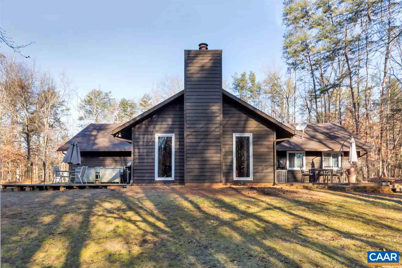 1065 Hunters Ridge Road Earlysville, VA 22936 - Photo 21 of 27 a view of a house with a yard covered in snow