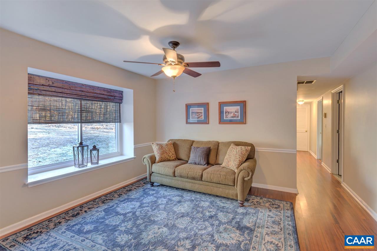 1065 Hunters Ridge Road Earlysville, VA 22936 - Photo 5 of 27 a living room with furniture and a large window