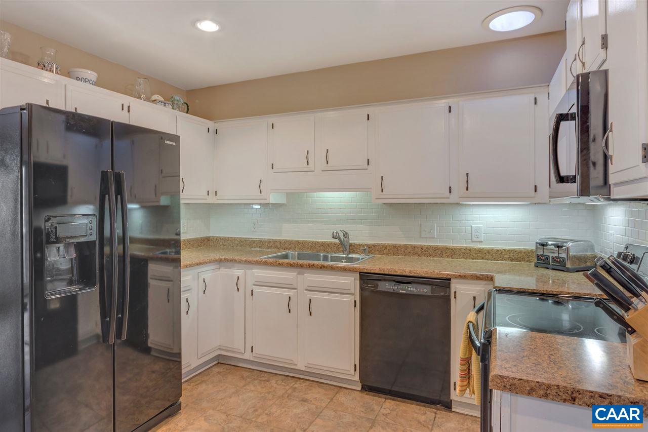 1065 Hunters Ridge Road Earlysville, VA 22936 - Photo 7 of 27 a kitchen with a sink stove and refrigerator