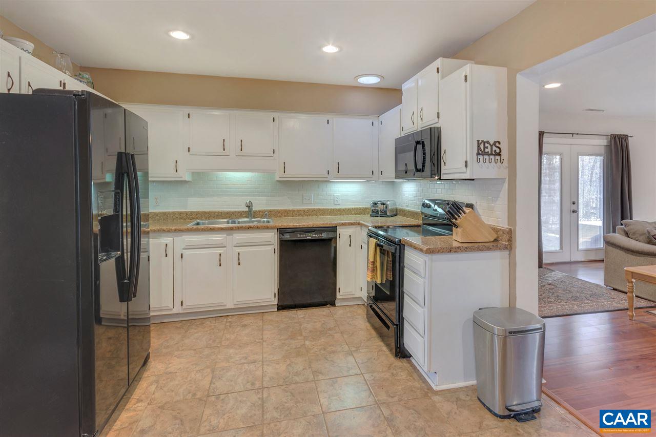 1065 Hunters Ridge Road Earlysville, VA 22936 - Photo 8 of 27 a kitchen with a sink stove and refrigerator