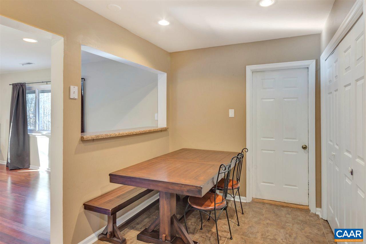 1065 Hunters Ridge Road Earlysville, VA 22936 - Photo 9 of 27 a view of a dining room with furniture and wooden floor