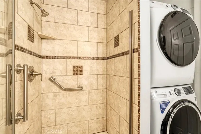 a balcony with table and chairs