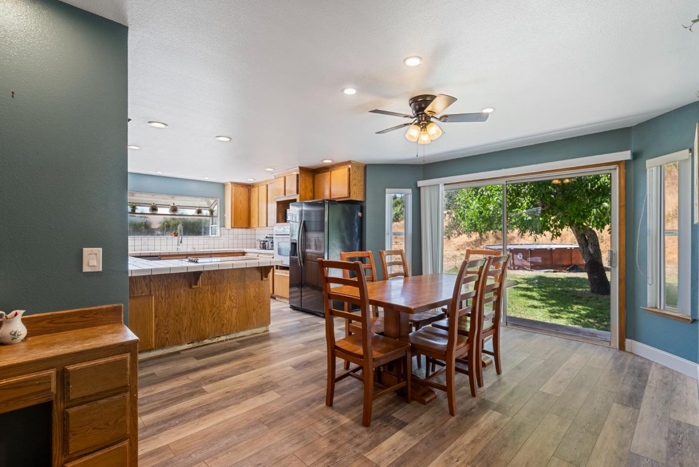 695 Hospital Road Hollister, CA 95023 - Photo 16 of 61 a view of a dining room with furniture window and wooden floor