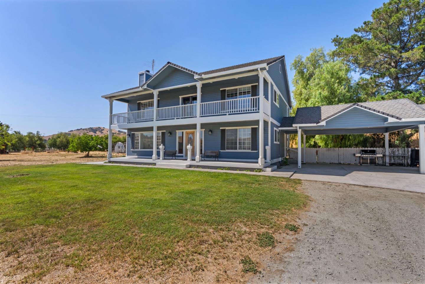 695 Hospital Road Hollister, CA 95023 - Photo 2 of 61 a front view of a house with a garden