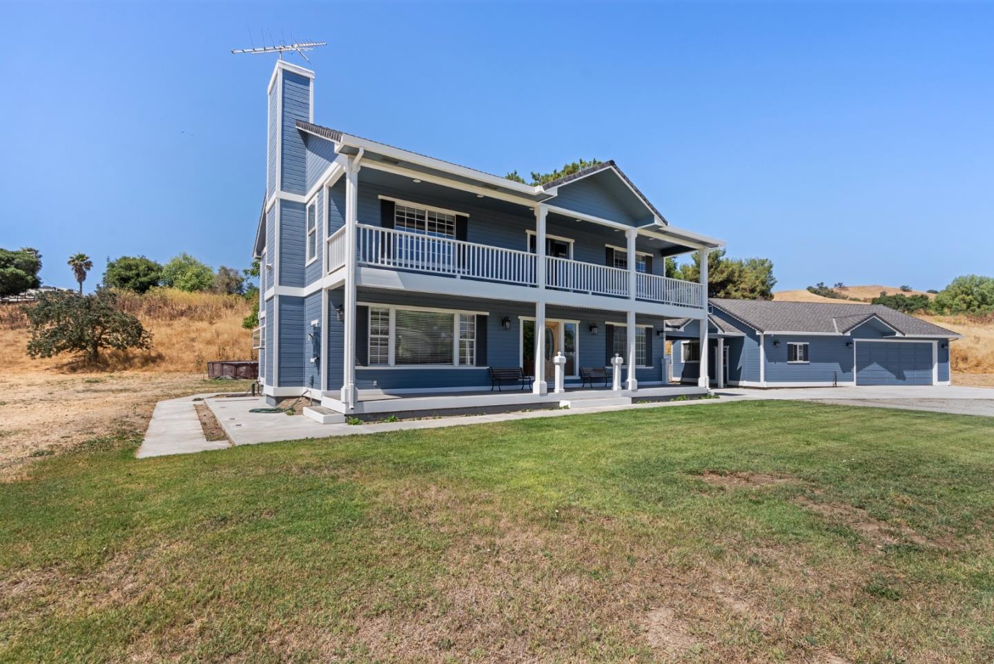 695 Hospital Road Hollister, CA 95023 - Photo 3 of 61 a view of a big house with a big yard and large trees