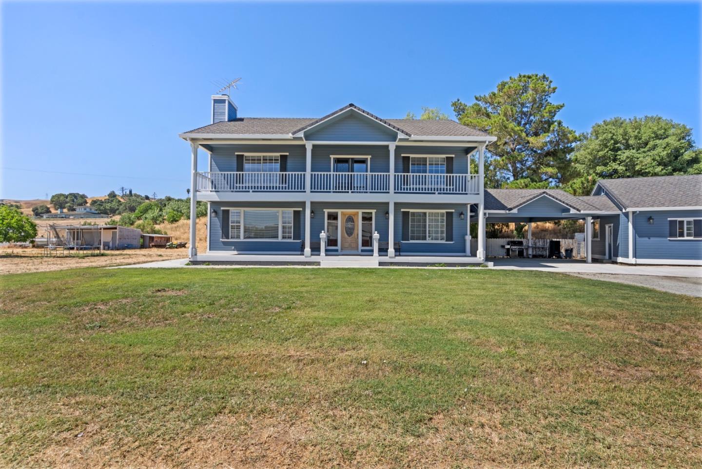 695 Hospital Road Hollister, CA 95023 - Photo 5 of 61 a front view of a house with a garden