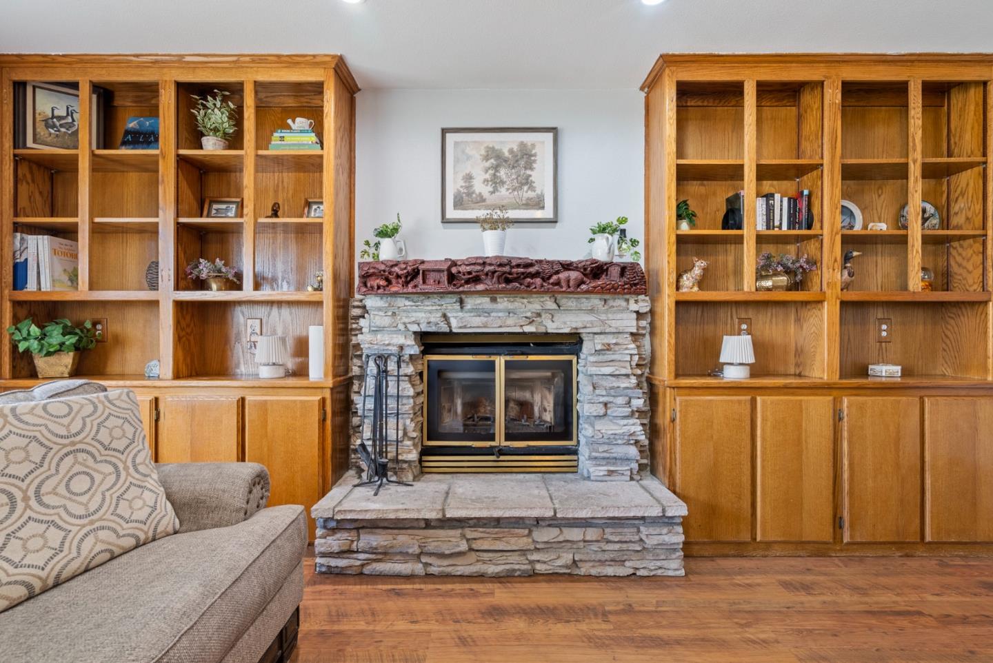 695 Hospital Road Hollister, CA 95023 - Photo 8 of 61 a living room with a fireplace and a book shelf