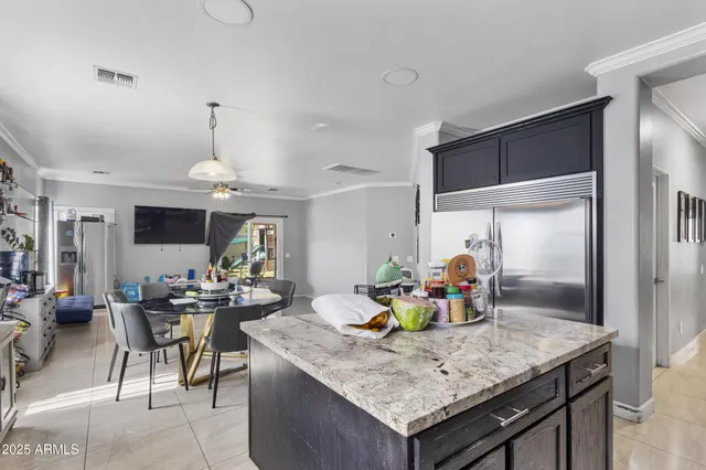 a kitchen with a table and chairs in it
