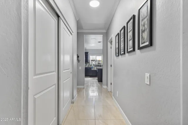 a view of a hallway with wooden shelves