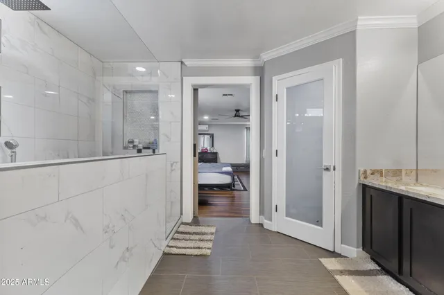 a bathroom with a sink and mirror