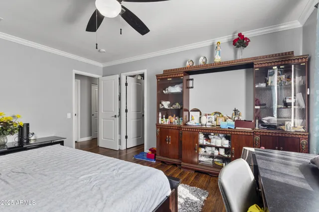 a bedroom with bed and a chandelier