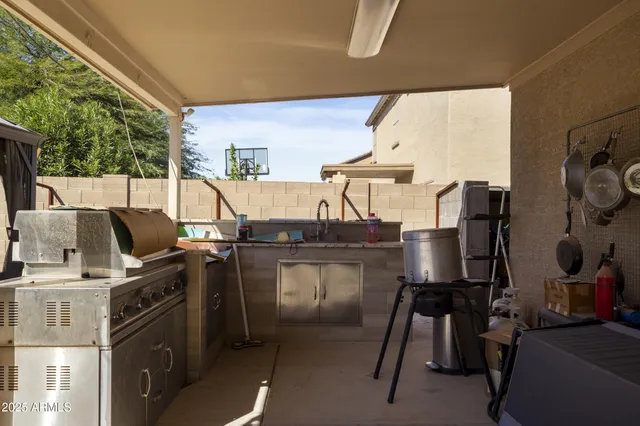 a kitchen with a sink appliances and cabinets