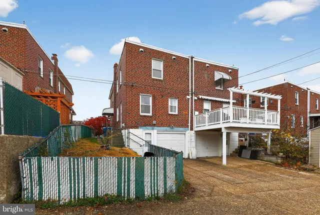 a view of a balcony with two chairs and a table