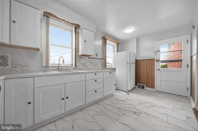 a bathroom with a sink and mirror